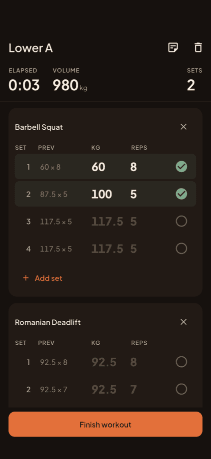 Active workout session logging sets, with previous-session values shown as ghost text